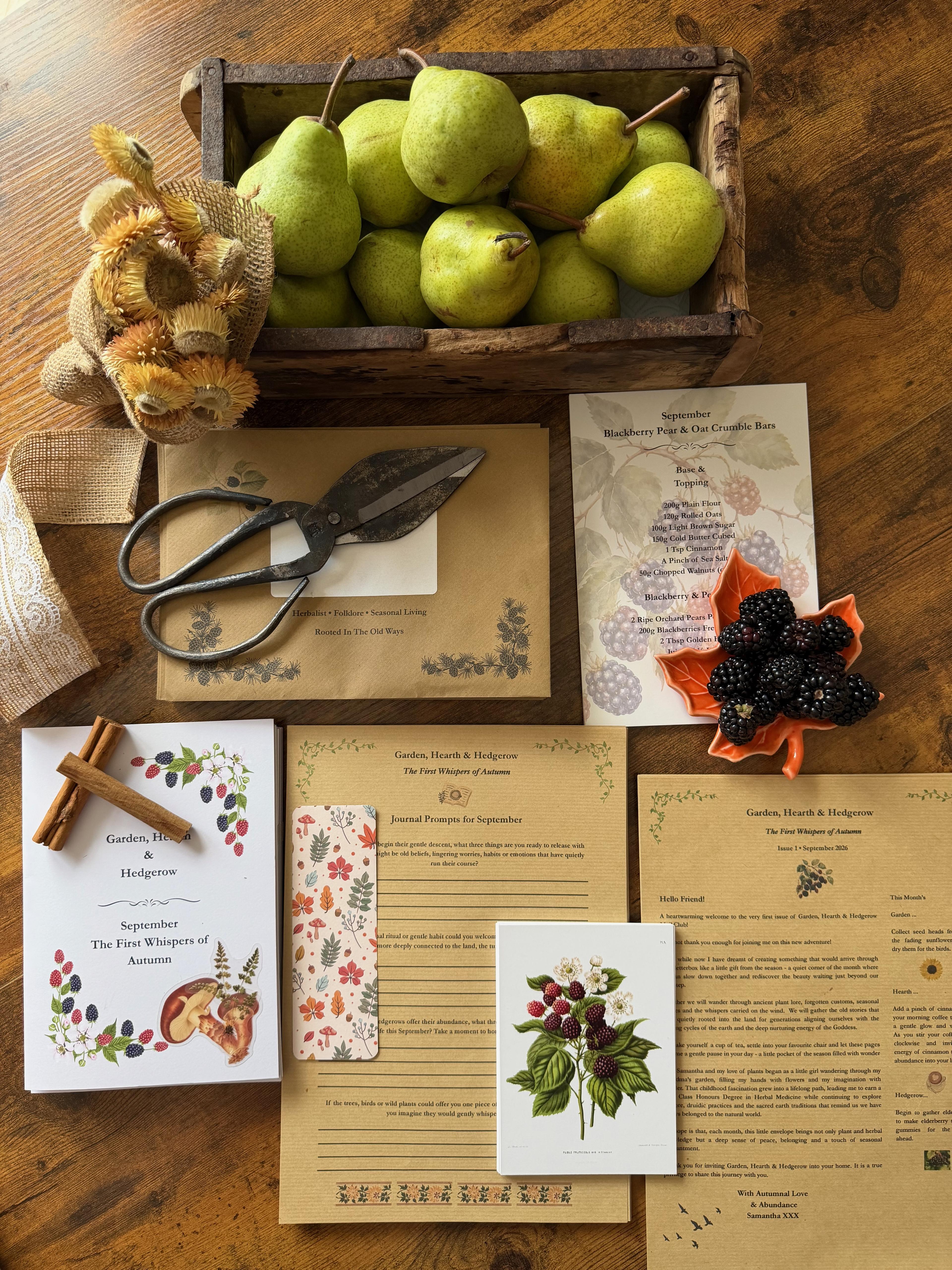 The September Garden, Hearth & Hedgerow subscription laid out on a wooden table
